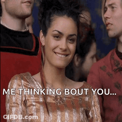 Woman In Striped Dress Smiling Saying Thinking Bout You GIF