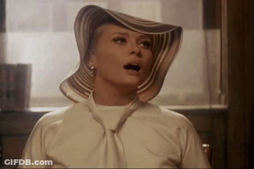 Woman In Striped Hat With Mouth Open GIF