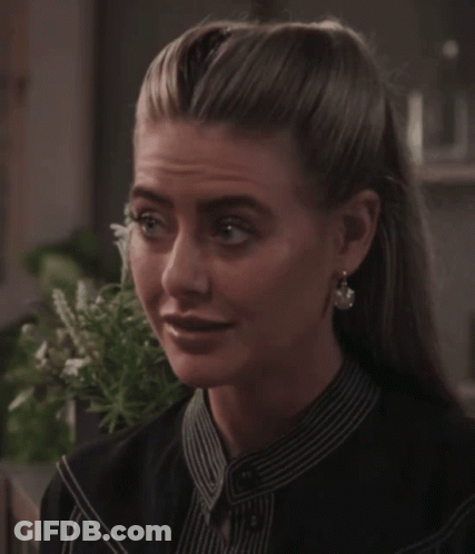 Woman In Striped Shirt And Earrings GIF