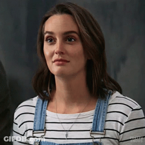 Woman In Striped Shirt And Overalls Looking GIF