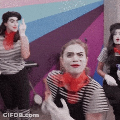 Woman In Striped Shirt And Red Scarf Making Funny Face GIF