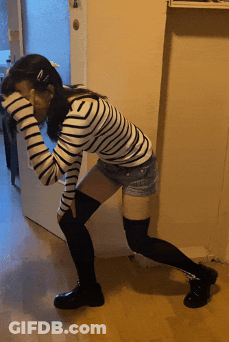 Woman In Striped Shirt And Shorts Kneeling GIF