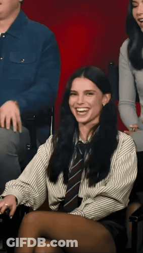 Woman In Striped Shirt And Tie Smiling GIF