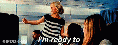 Woman In Striped Shirt Dancing On Airplane GIF