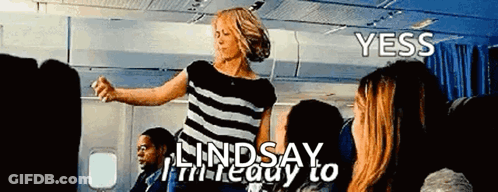 Woman In Striped Shirt Dancing On Airplane GIF