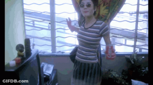 Woman In Striped Shirt Holding Coca Cola Can GIF