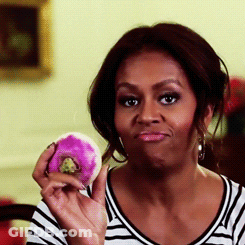 Woman In Striped Shirt Holding Pink Donut GIF