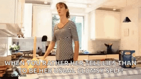Woman In Striped Shirt Holding Rolling Pin GIF