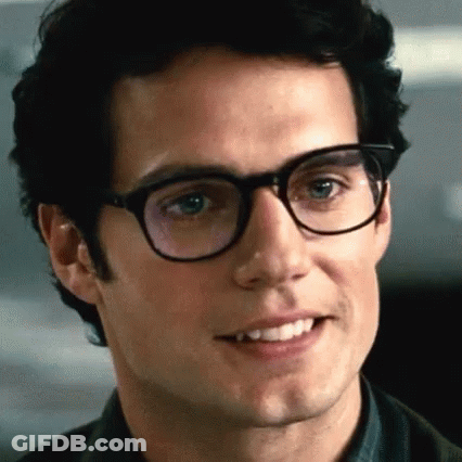 Woman In Striped Shirt In Front Of Suited Group GIF