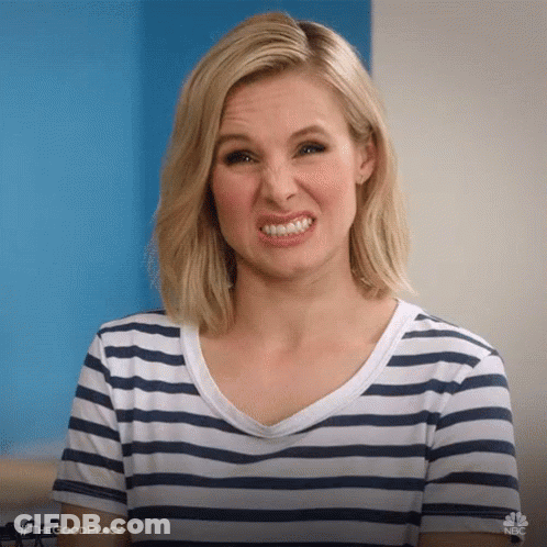 Woman In Striped Shirt Making A Face GIF