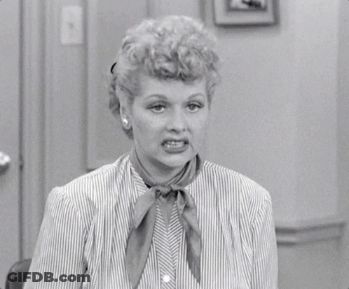 Woman In Striped Shirt Making Funny Face GIF