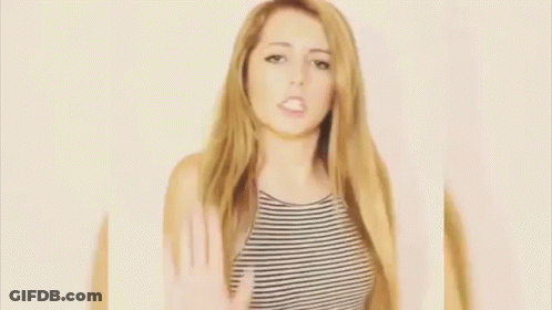 Woman In Striped Shirt Making Heart With Hands GIF