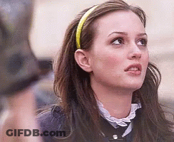 Woman In Striped Shirt Overalls Looking At Camera GIF