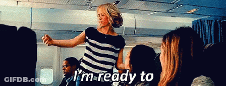 Woman In Striped Shirt Says I'm Ready To On An Airplane GIF