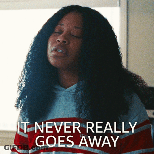 Woman In Striped Shirt Says It Never Really Goes Away GIF