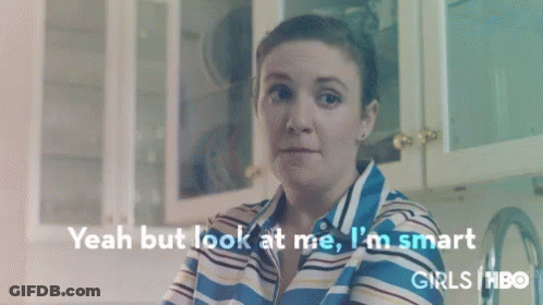 Woman In Striped Shirt Sitting In Kitchen GIF