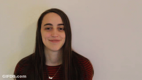 Woman In Striped Shirt Smiling GIF