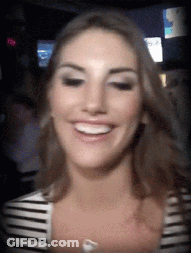 Woman In Striped Shirt Smiling At 8:08 Clock GIF