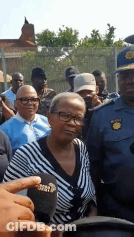 Woman In Striped Shirt Speaking Into Microphone GIF
