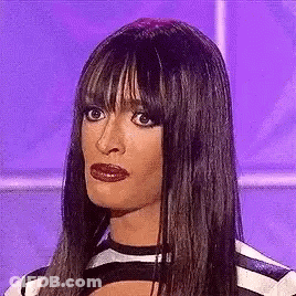 Woman In Striped Shirt With Bangs Funny Face GIF