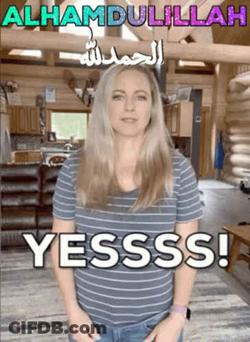 Woman In Striped Shirt With Yesss Sign GIF