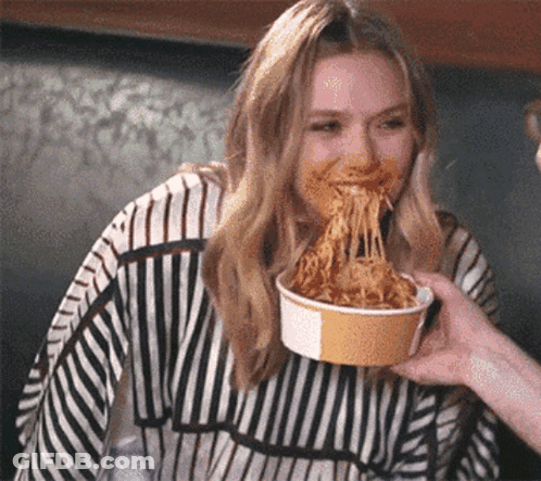 Woman In Striped Sweater Eating Spaghetti GIF