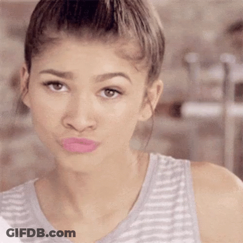 Woman In Striped Tank Top Making Face GIF
