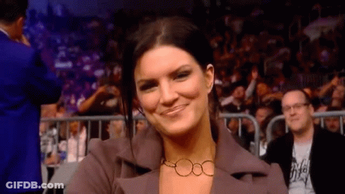 Woman In Suit And Necklace Smiling GIF