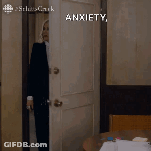 Woman In Suit And Tie In Front Of Anxiety Door GIF