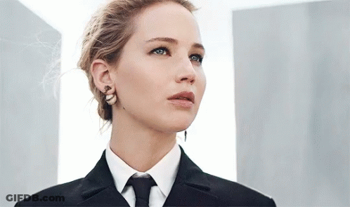 Woman In Suit And Tie Looking Up At Sky GIF