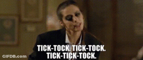 Woman In Suit And Tie Saying Tick-Tock Tick-Tock Tick-Tock GIF