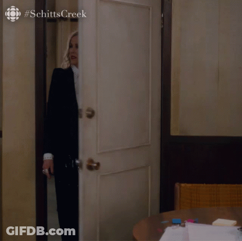 Woman In Suit And Tie Standing In Doorway #SchittsCreek GIF