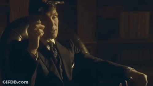 Woman In Suit And Tie Talking To Another Woman GIF