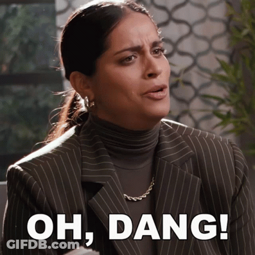 Woman In Suit And Turtleneck Saying Oh Dang GIF