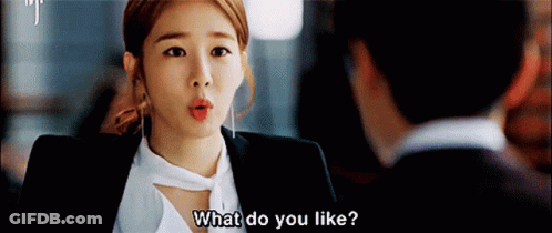 Woman In Suit Asking Man What Do You Like GIF