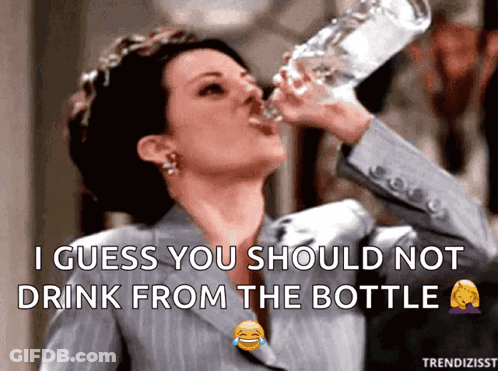 Woman In Suit Drinking Bottle Caption I Guess You Should Not Drink From Bottle GIF