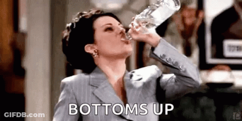 Woman In Suit Drinking Bottle Of Water GIF
