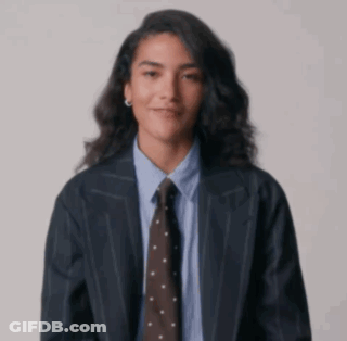 Woman In Suit Giving Middle Finger GIF