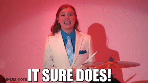 Woman In Suit Holding Drumstick It Sure Does GIF
