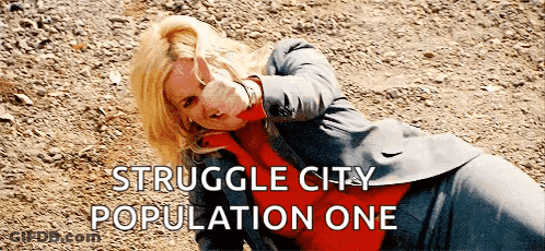 Woman In Suit Laying On Ground Struggle City Population One GIF