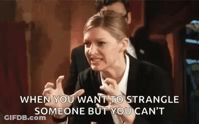 Woman In Suit Making Funny Face GIF