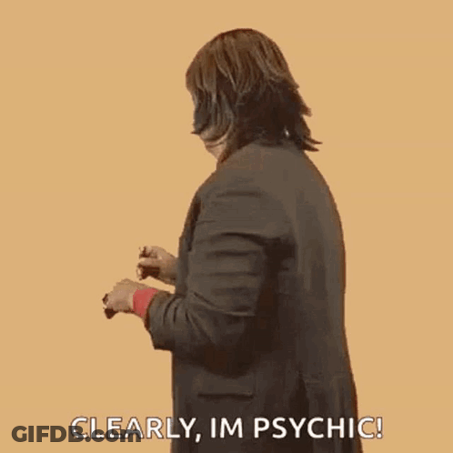 Woman In Suit Making Funny Face Saying Im Psychic GIF