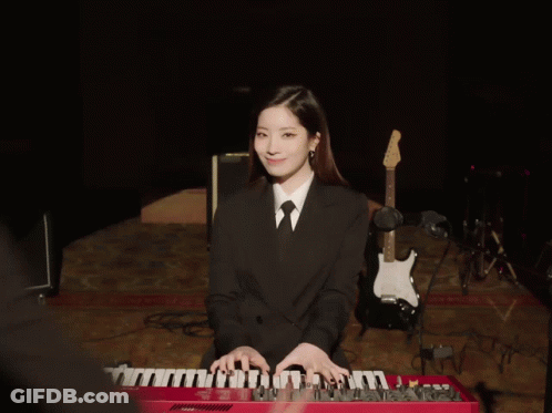 Woman In Suit Playing Keyboard GIF