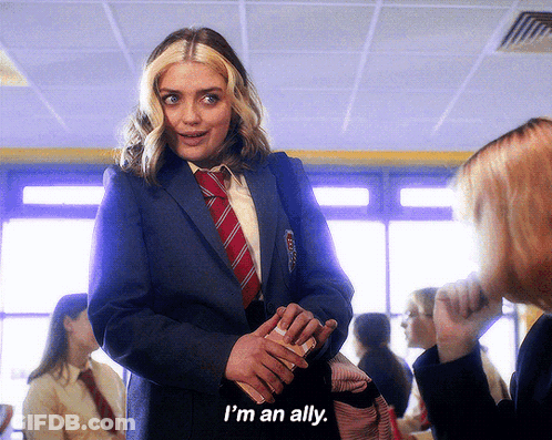 Woman In Suit Saying I'm An Ally GIF