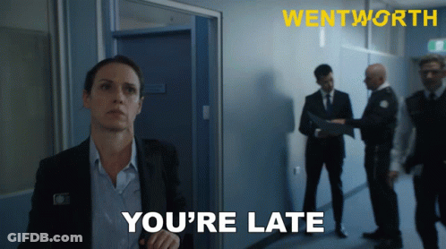 Woman In Suit Saying You're Late GIF