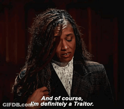Woman In Suit Says Being A Traitor GIF
