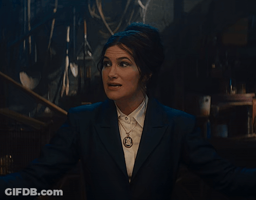 Woman In Suit Singing Down Down Down GIF