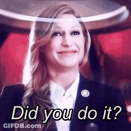 Woman In Suit Smiling Asking Did You Do It GIF