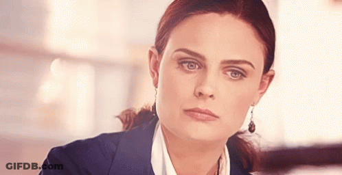 Woman In Suit With Earrings GIF