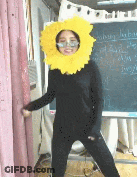 Woman In Sunflower Costume With Shabang Shaping Chalkboard GIF